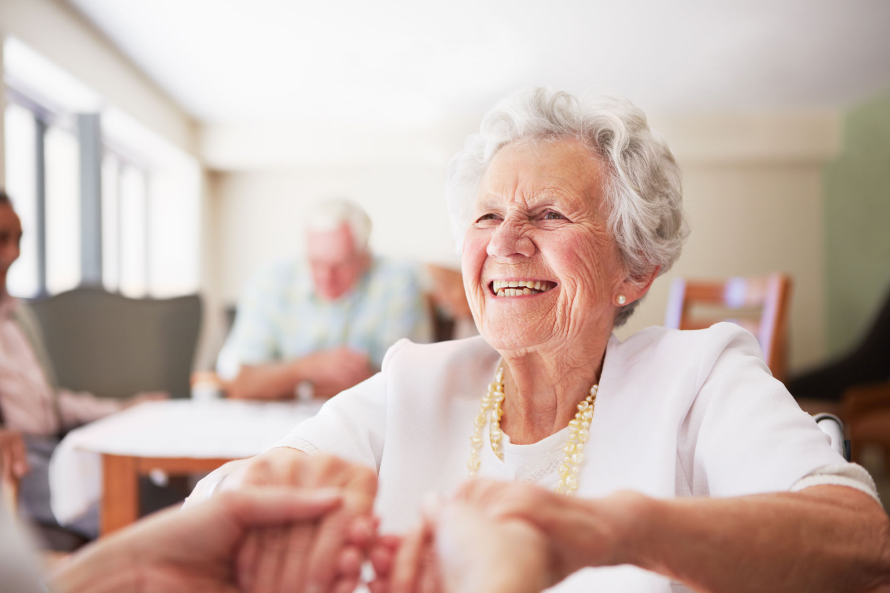 Elderly woman grinning