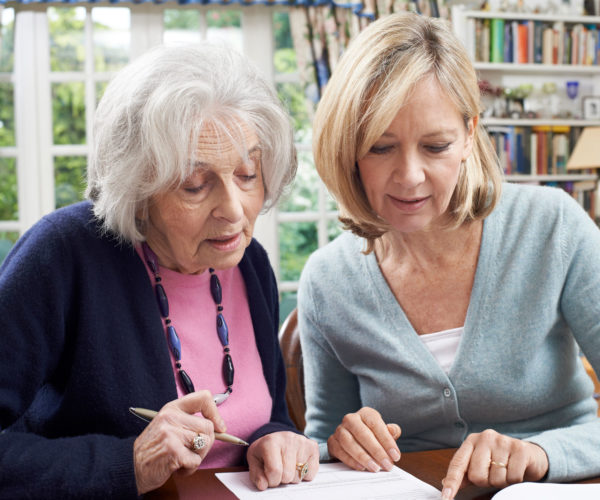 Mother and daughter looking over paperwork