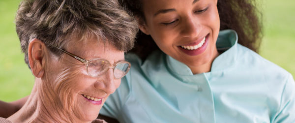 Two women smiling together